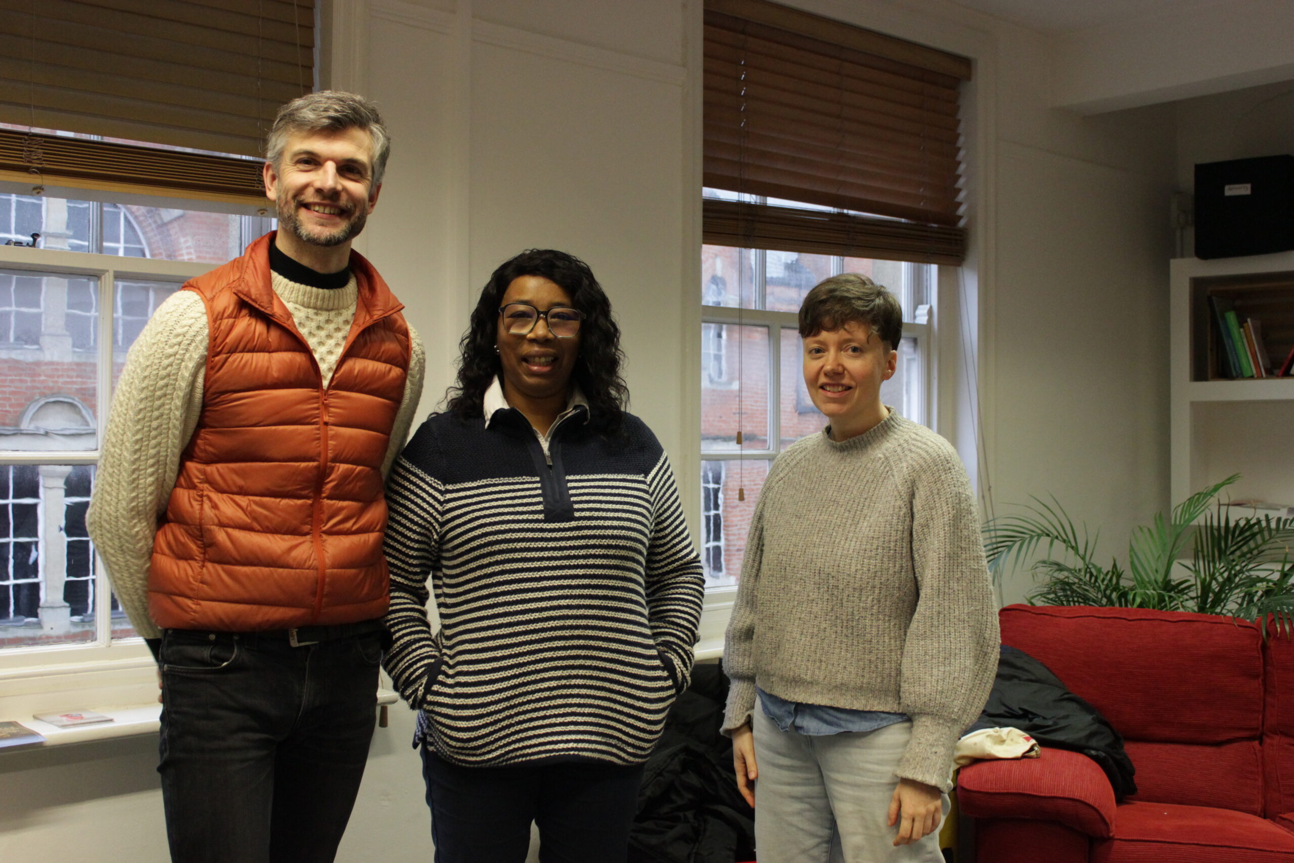 Three people posing for the camera