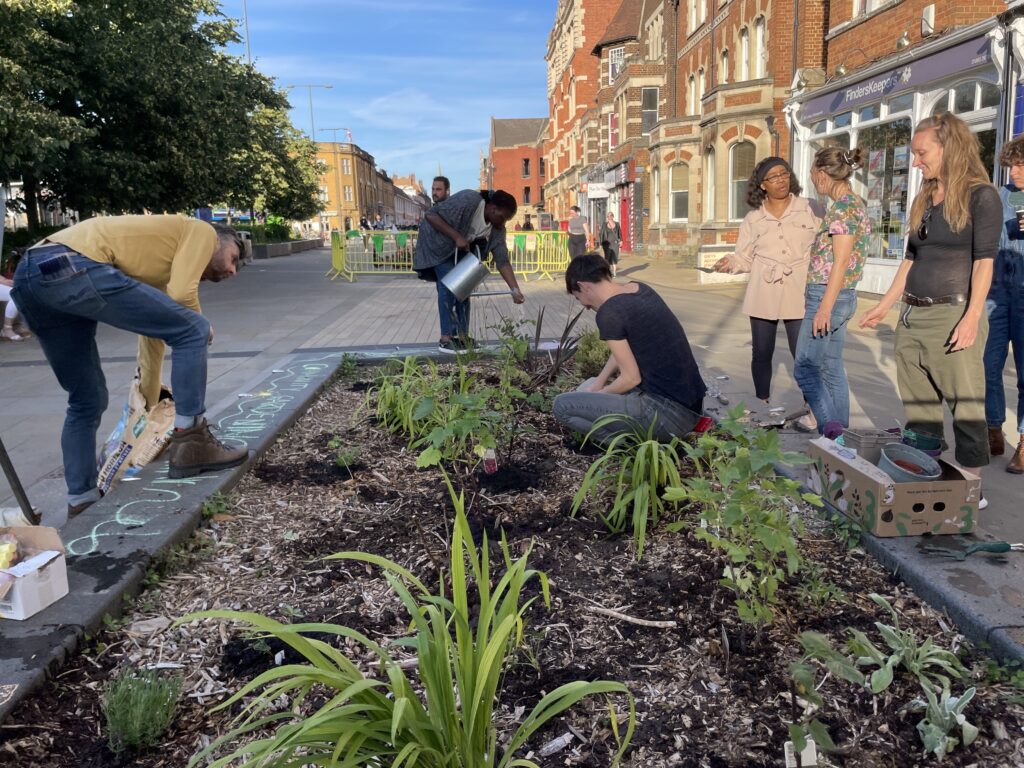 A group of people tending a community garden